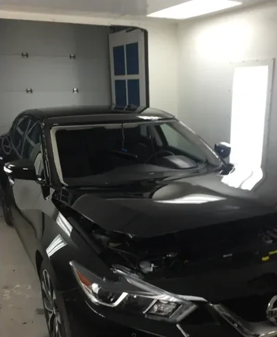 Nissan Maxima with a smashed windshield before replacement